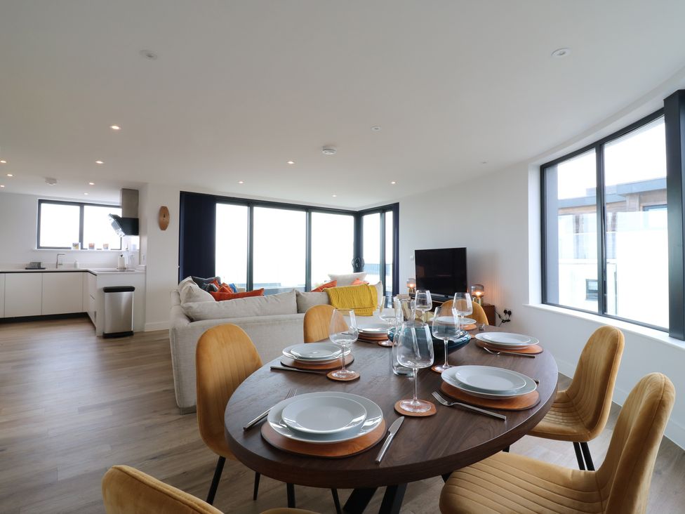A dining room with a table set for dinner at Flat 4 in Hythe