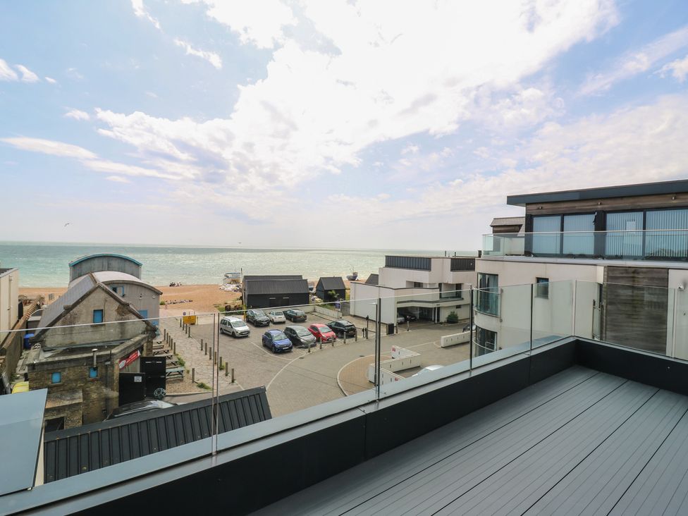 A view of the sea and beach from a balcony at Flat 4 in Hythe