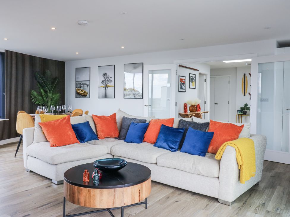 A living room with a sofa and coffee table at Flat 4 in Hythe