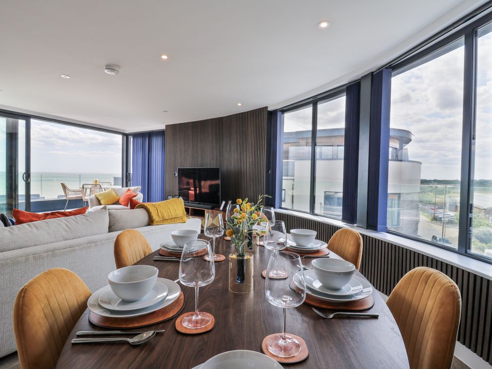 A dining room with a table set and view at Flat 4 in Hythe