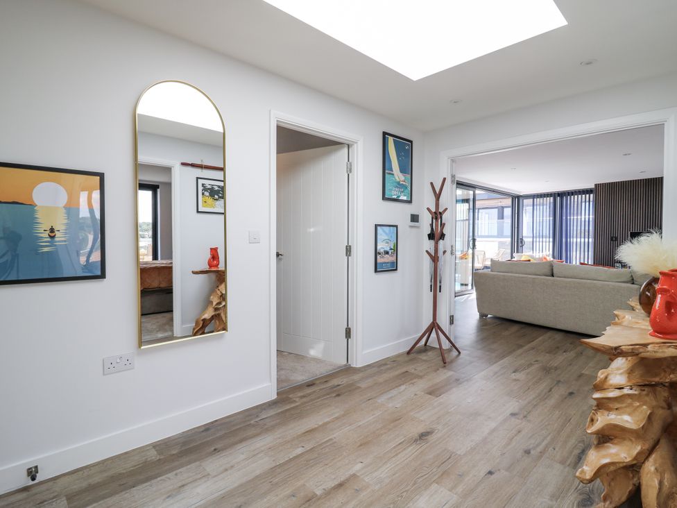 A hallway with wall art and a mirror at Flat 4 in Hythe