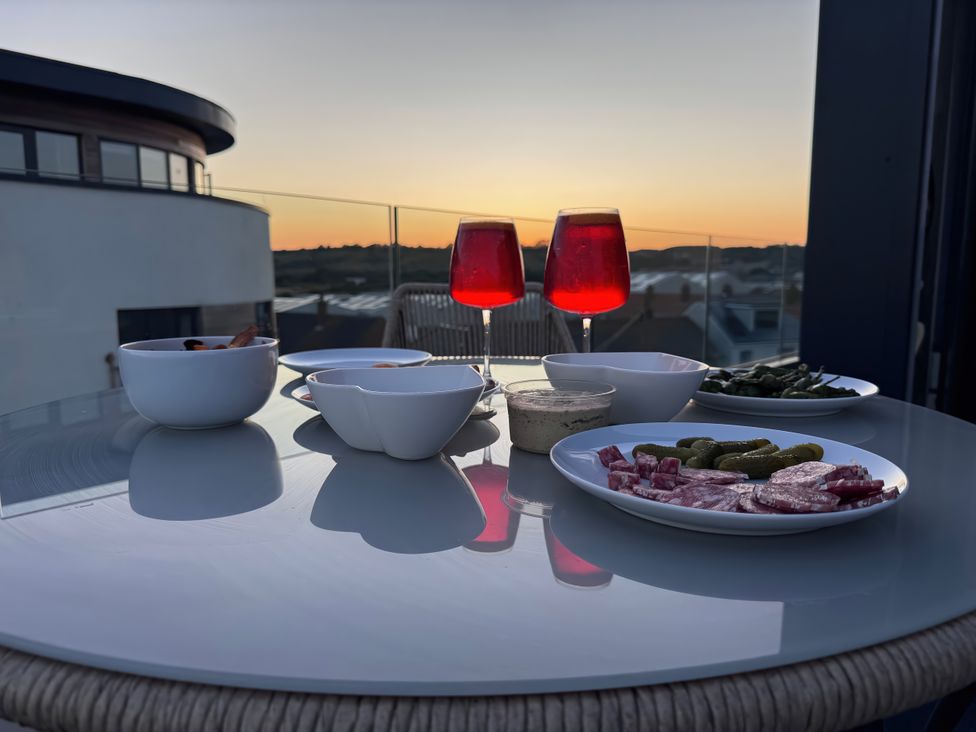 A dining setup with snacks and drinks at Flat 4 in Hythe
