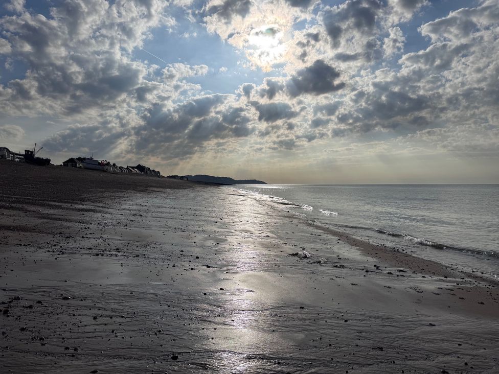 A beach with water and clouds at Flat 4 in Hythe
