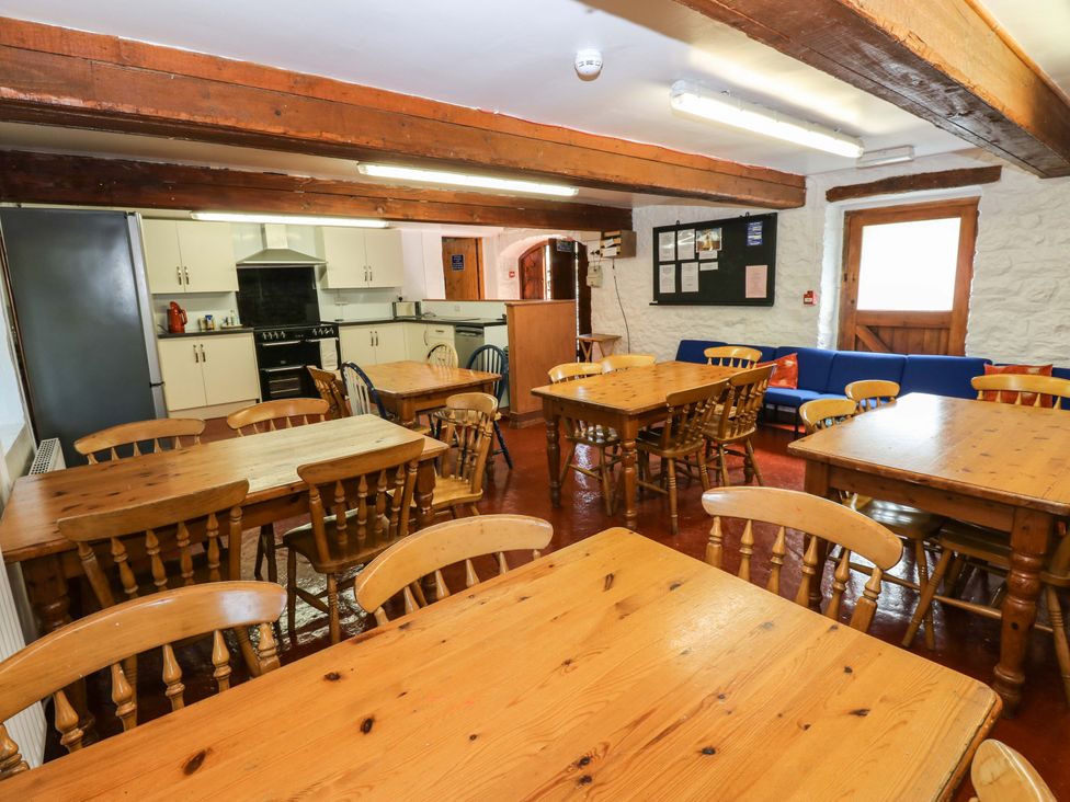 A dining room with tables and chairs at West Barn 