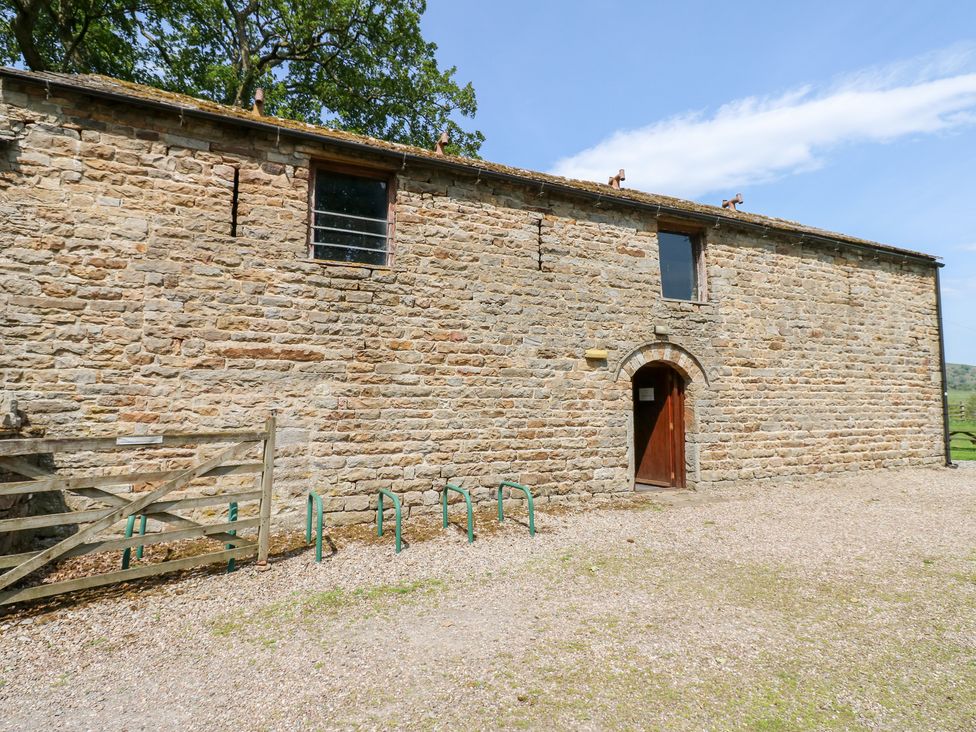 A stone building with a door and window at East Barn Bunkhouse 