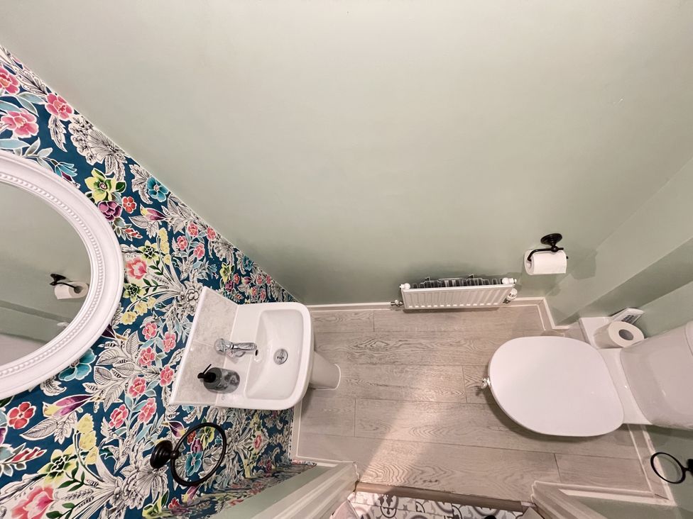A bathroom with a sink and toilet at Derby Den Breadsall near Derby