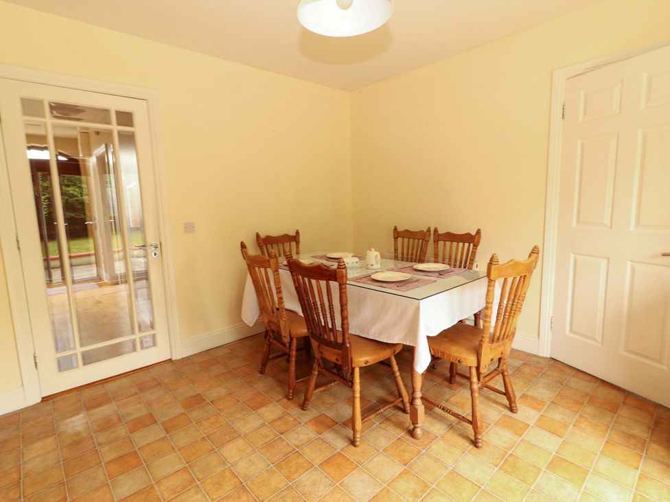 A dining room with a table and chairs at 51 Woodview Park Tralee, County Kerry