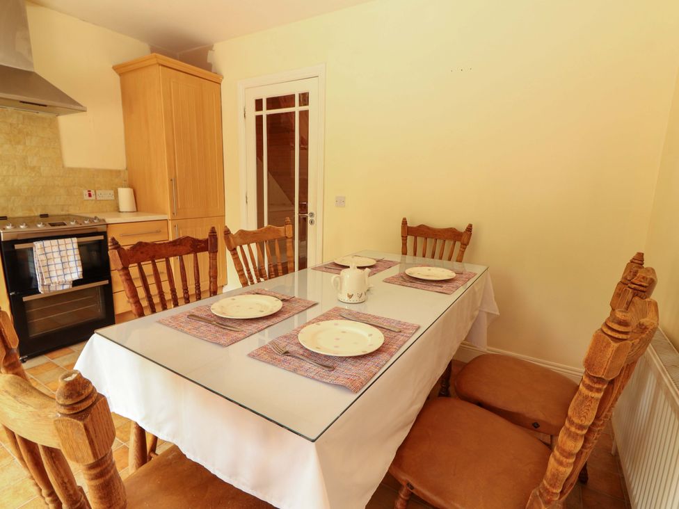 A dining room with a table and chairs at 51 Woodview Park Tralee County Kerry