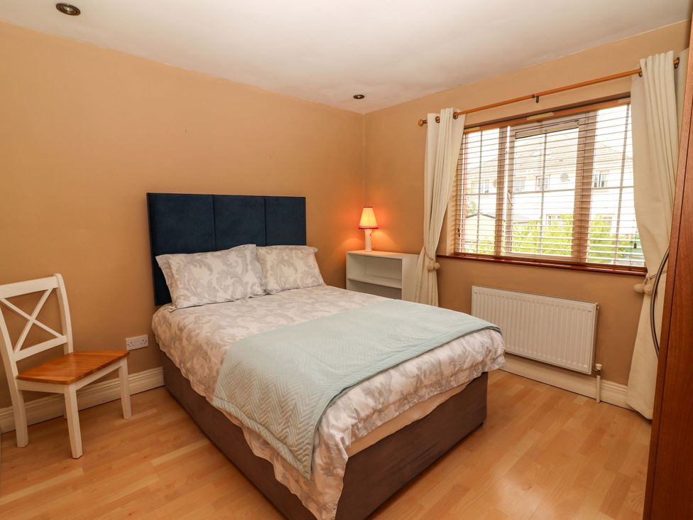 A bedroom with a bed and a window at 51 Woodview Park Tralee, County Kerry