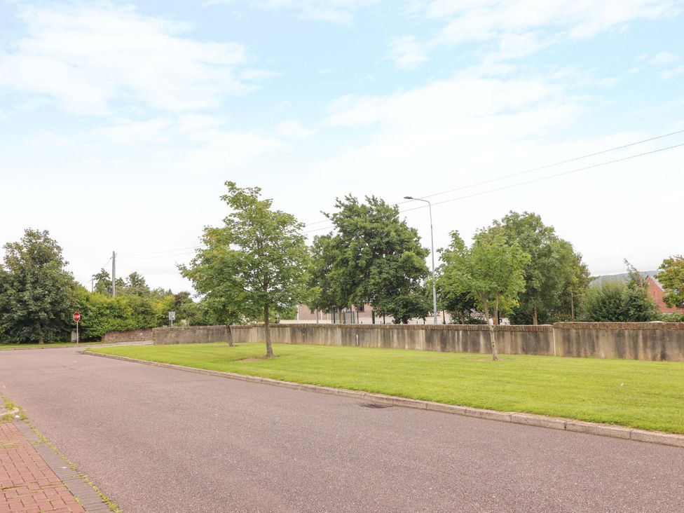 An outdoor area with trees and a road at 51 Woodview Park, Tralee, County Kerry