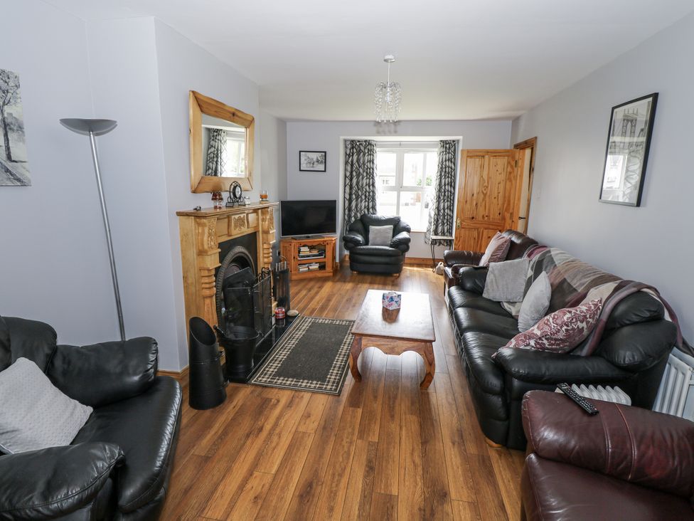 A living room with a TV and fireplace at 22 White Maples in Bundoran, County Donegal
