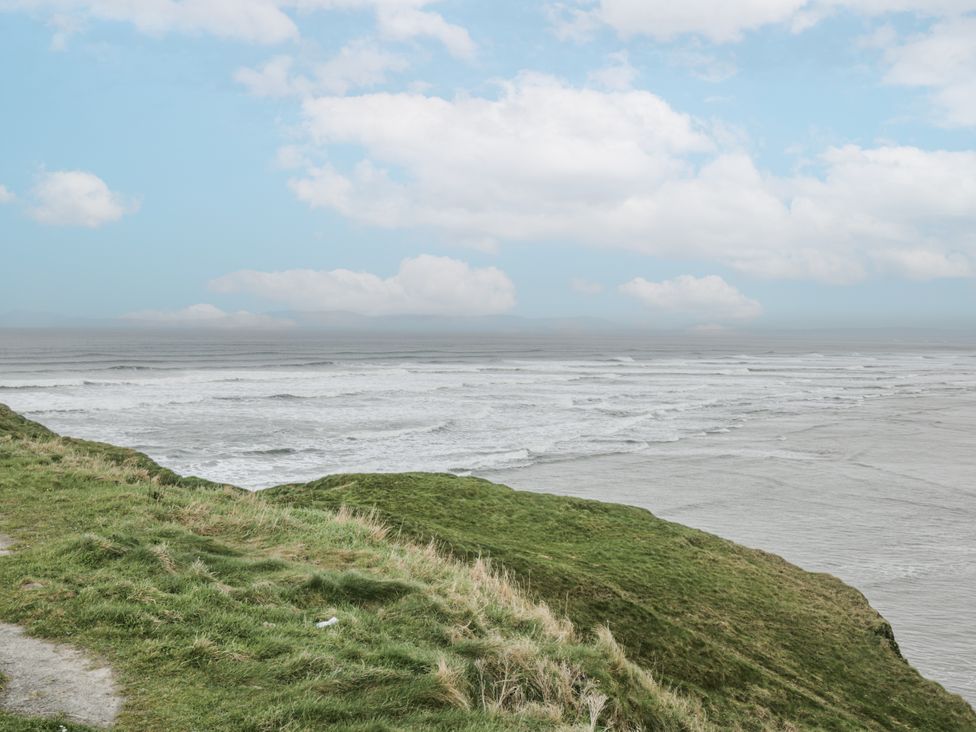 A view of the ocean with waves from a grassy cliff at 22 White Maples, Bundoran, County Donegal