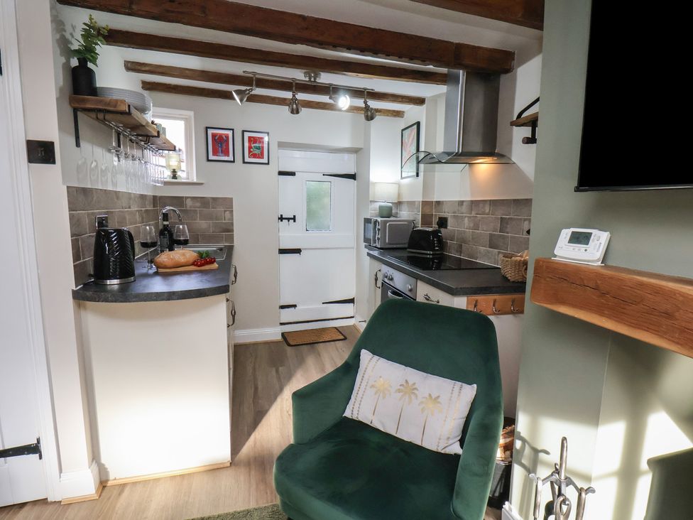 A kitchen with countertop and appliances at Chimes Cottage in Guisborough