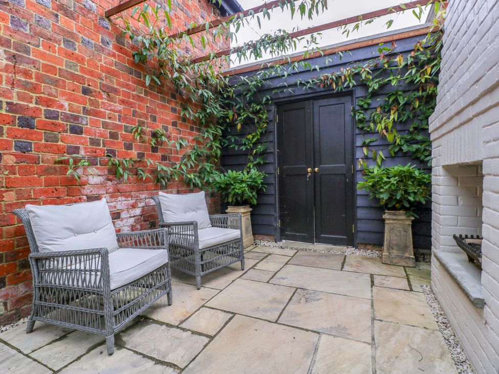 A garden area with seating and plants at The Sty near Shades Farm Malmesbury