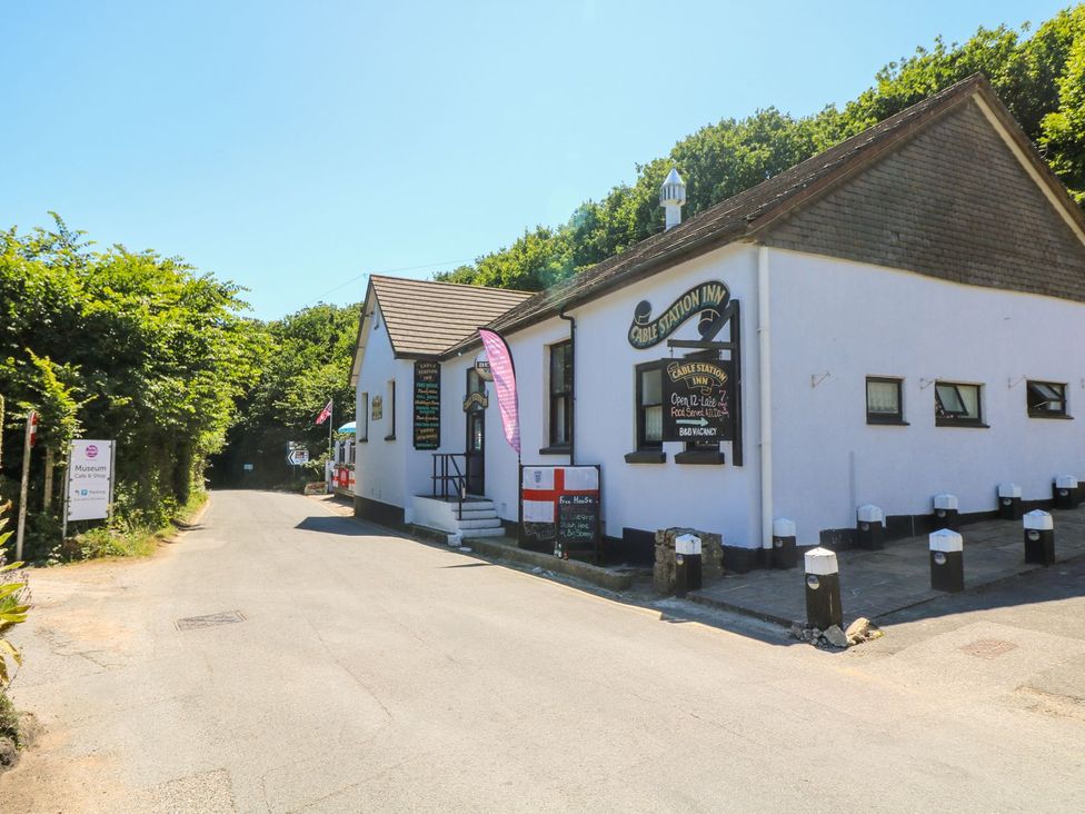 An exterior view of the Cable Station Inn on a road near Porthcurno