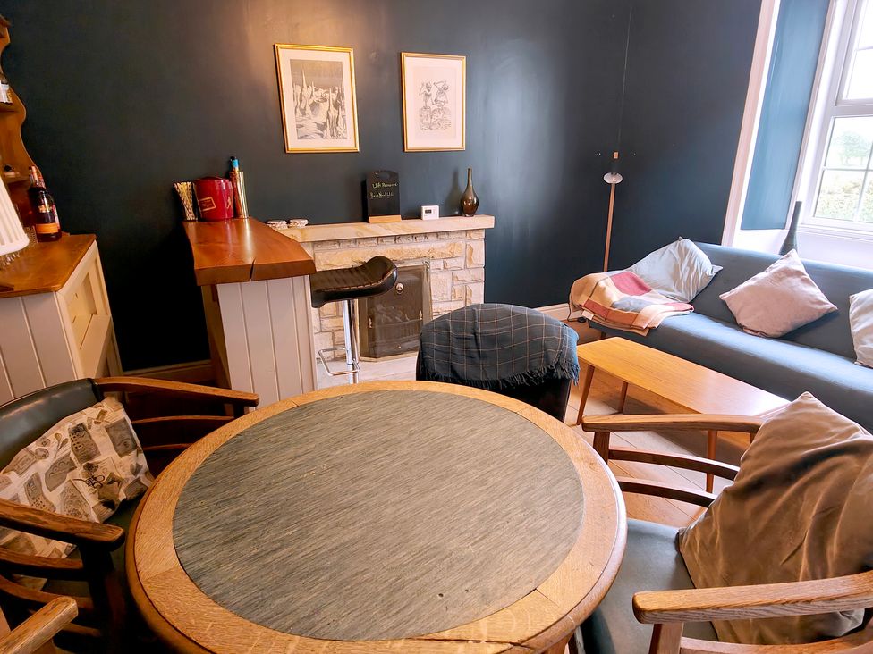 A snug with a bar and seating arrangement at Bush Nook House in Brampton