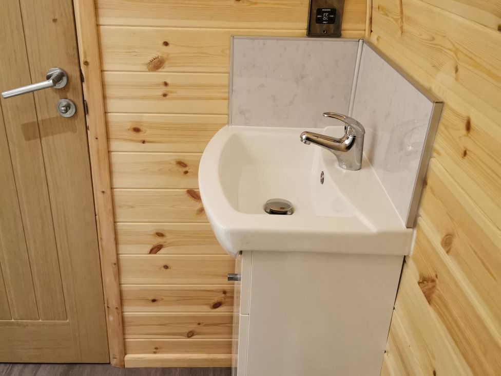 A sink with a faucet in a bathroom at Lodge 1 Pontyates