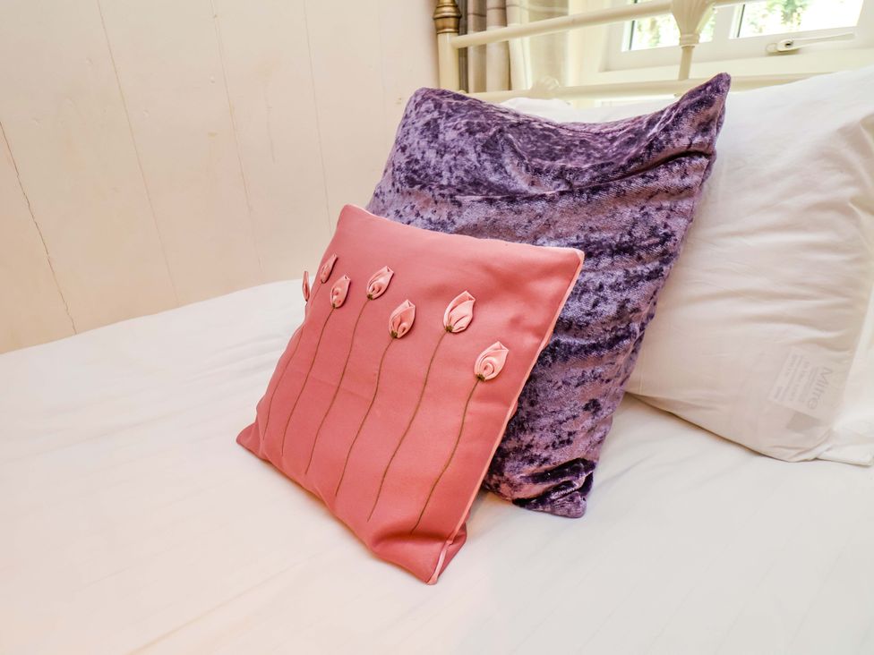 Two pillows on a bed at 5 Hollins Cottages in Whitby