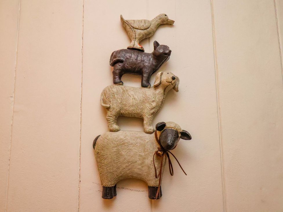 Decorative animal figures on a wall at 5 Hollins Cottages Whitby