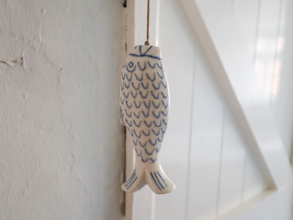 A fish decoration hanging on a wall at Buttercup in Blakeney, Norfolk