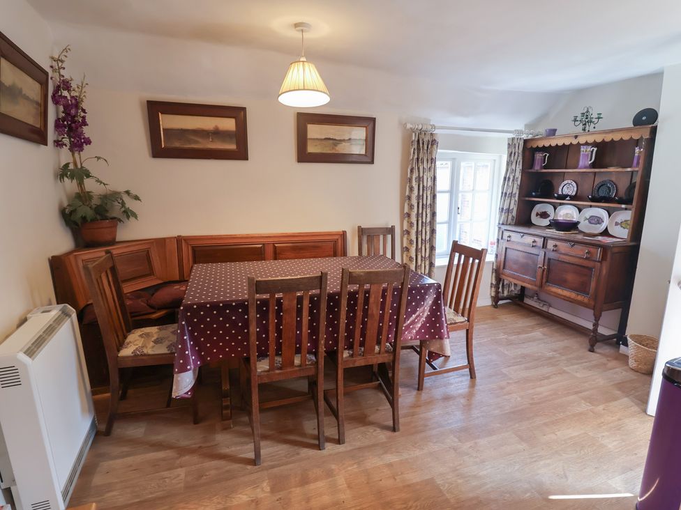 A dining room with a table and chairs at The Plover in Blakeney, Norfolk