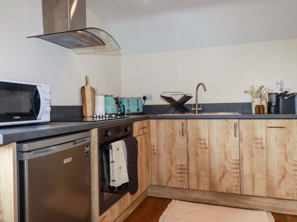 A kitchen with appliances and utensils at The Hideaway in Tintagel
