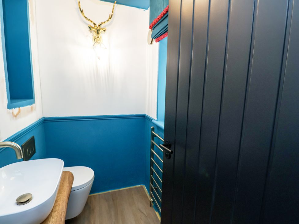 A bathroom with a sink and toilet at Holly Farm in Colchester