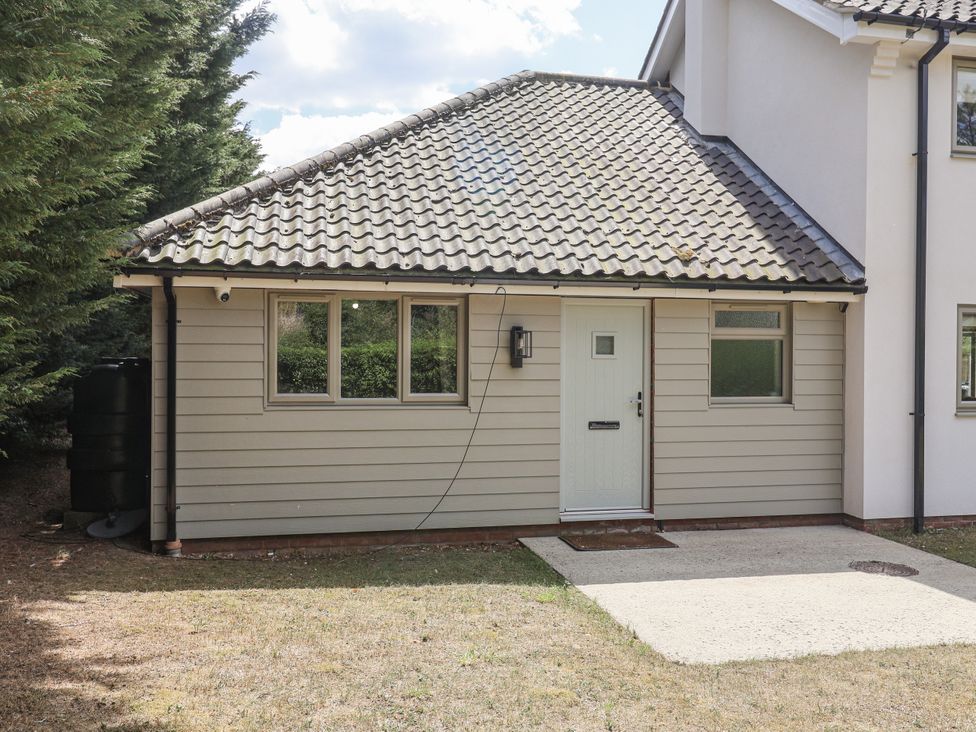 An exterior view of a property with a door and windows at Annexe in Colchester