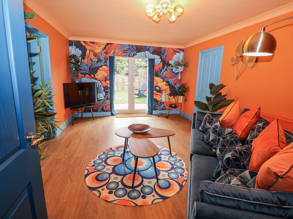 A living room with a sofa and coffee table at Annexe in East End near Brantham