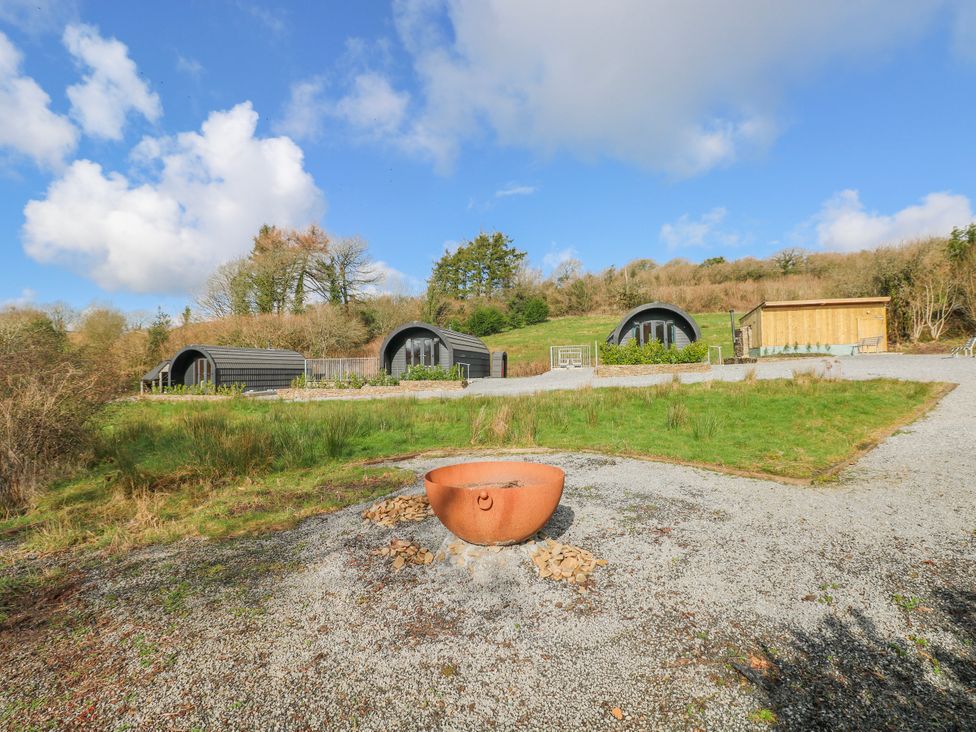 Holiday pods with a wooden structure at Lodge 2 near Pontyates