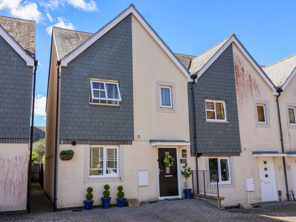 A residential house with a front door and windows at 21 Olympic Way in Plymouth