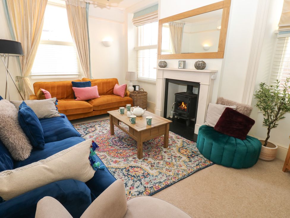 A living room with a sofa and coffee table at Hampton House in St. Bees