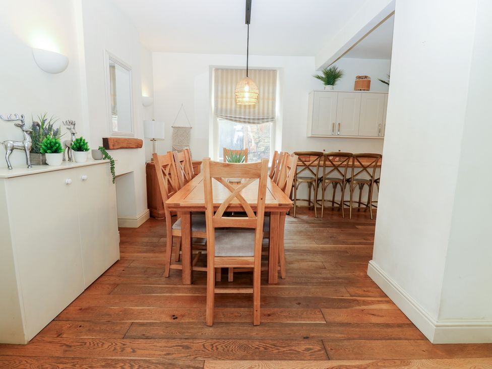 A dining room with a table and chairs at Hampton House in St. Bees