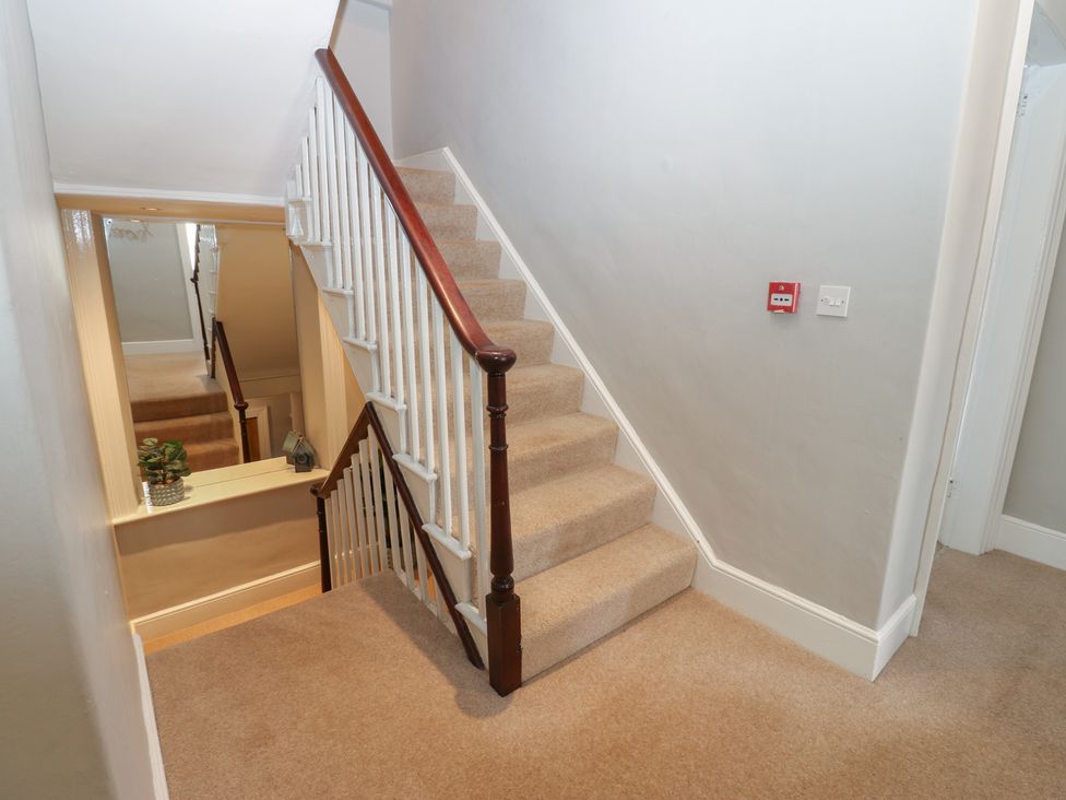 A staircase with a plant at Hampton House in St. Bees