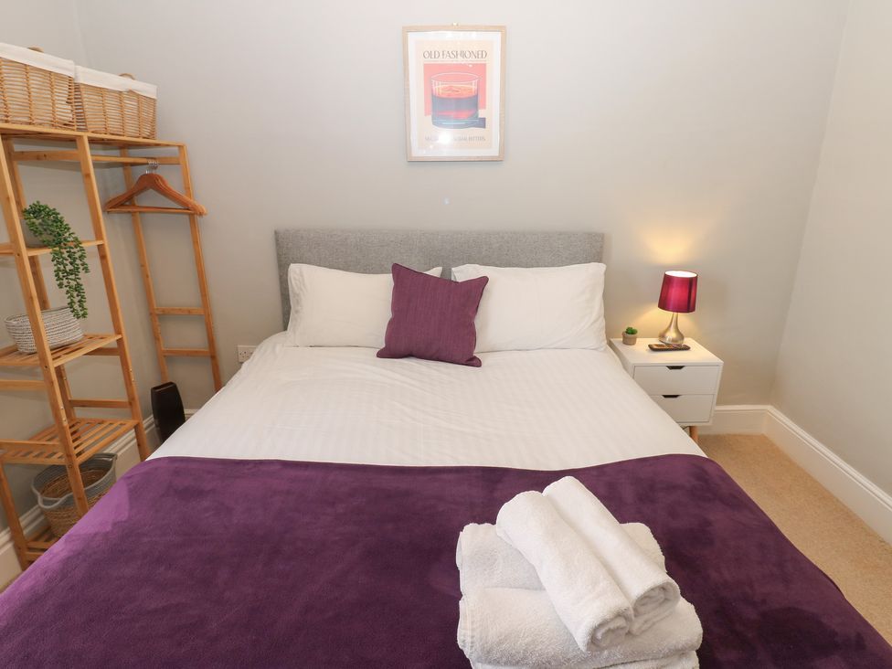 A bedroom with a bed and plant at Hampton House in St. Bees