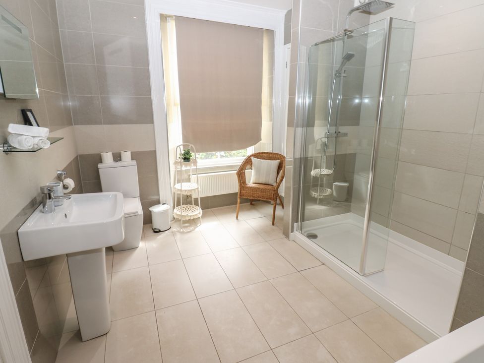 A bathroom with sink, toilet, and shower at Hampton House in St. Bees