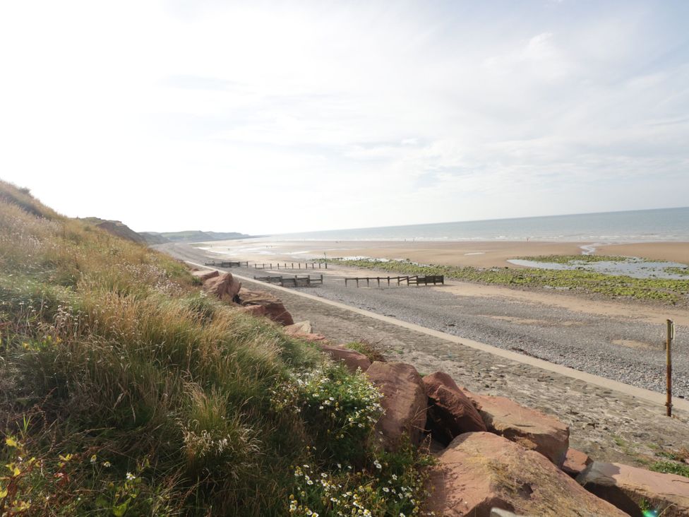 A beach with sand and ocean at Hampton House in St. Bees