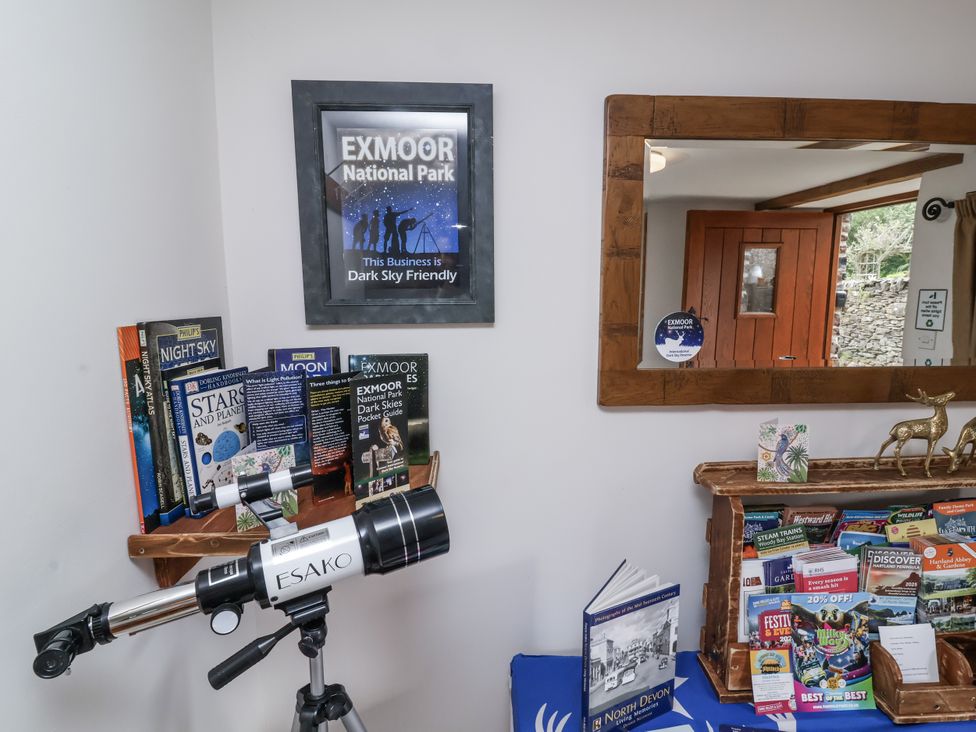 A display with telescope and books at Lane End in North Molton