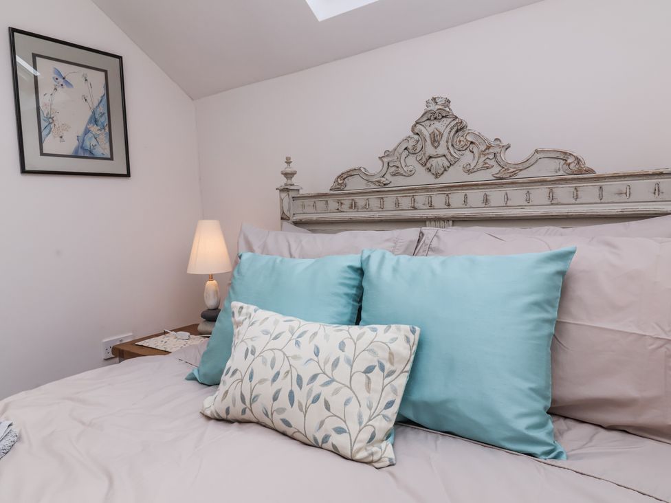 A bedroom with a bed and pillows at Lane End in North Molton
