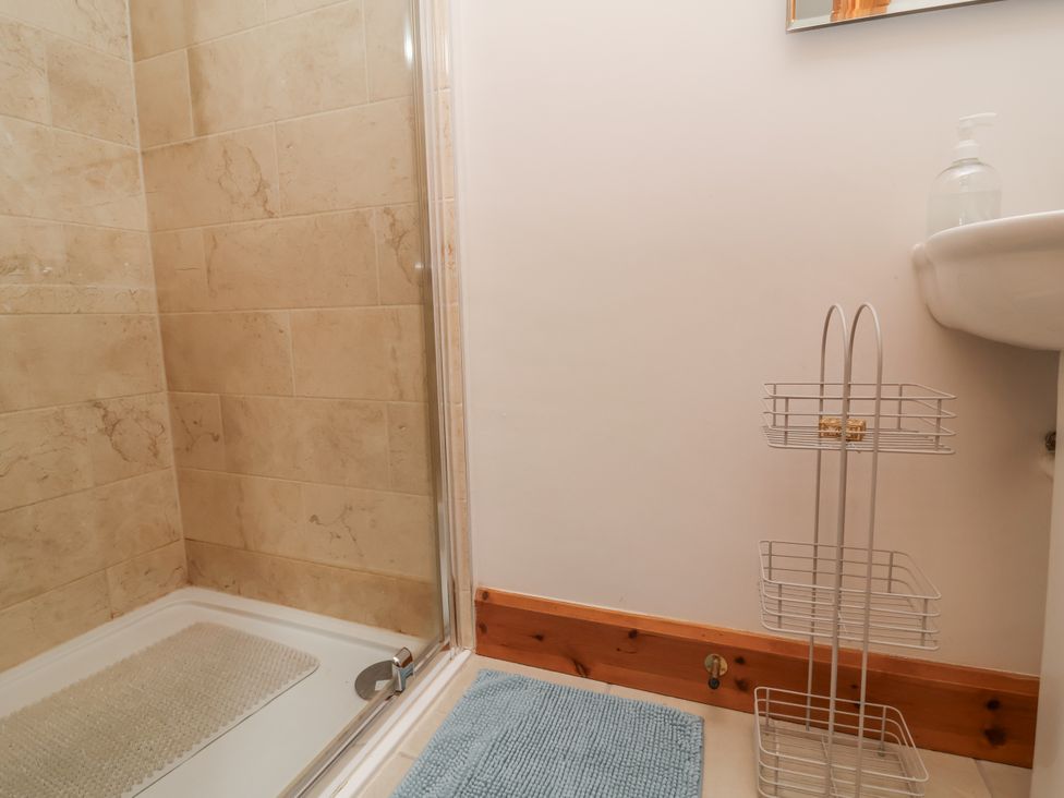 A bathroom with a shower and sink at Lane End North Molton