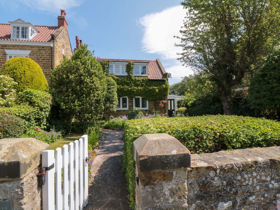A house with a garden and pathway at Scalby Grove Cottage in Scalby