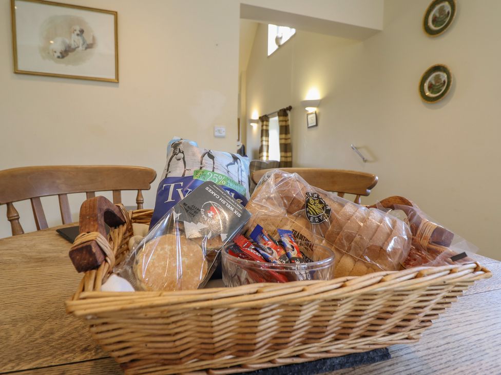 A basket with snacks on a table at Upper Pandy Farm in Berriew near Welshpool