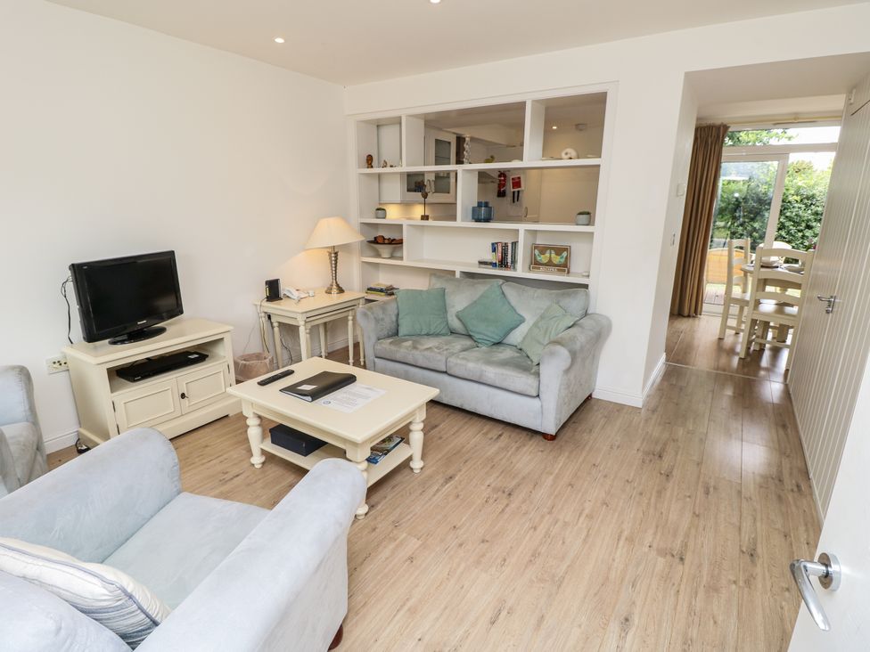 A living room with furniture including a sofa and television at Vermont 4 in Yarmouth
