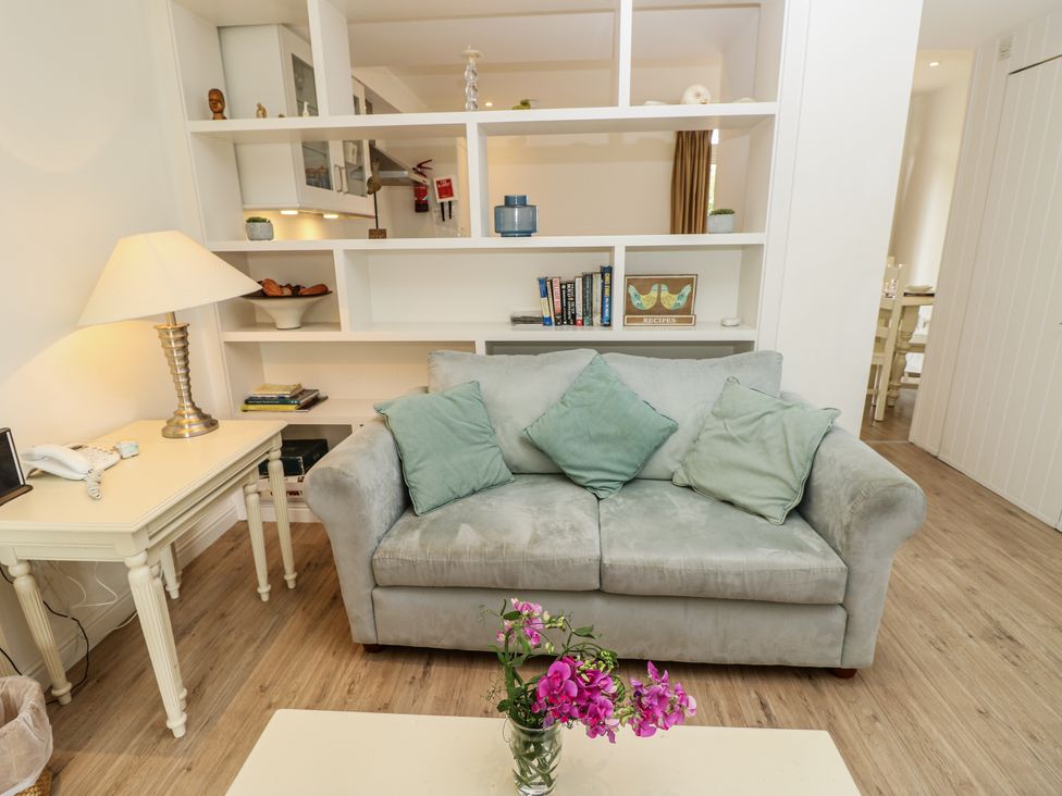 A living room with a sofa and decorative items at Vermont 4 Yarmouth