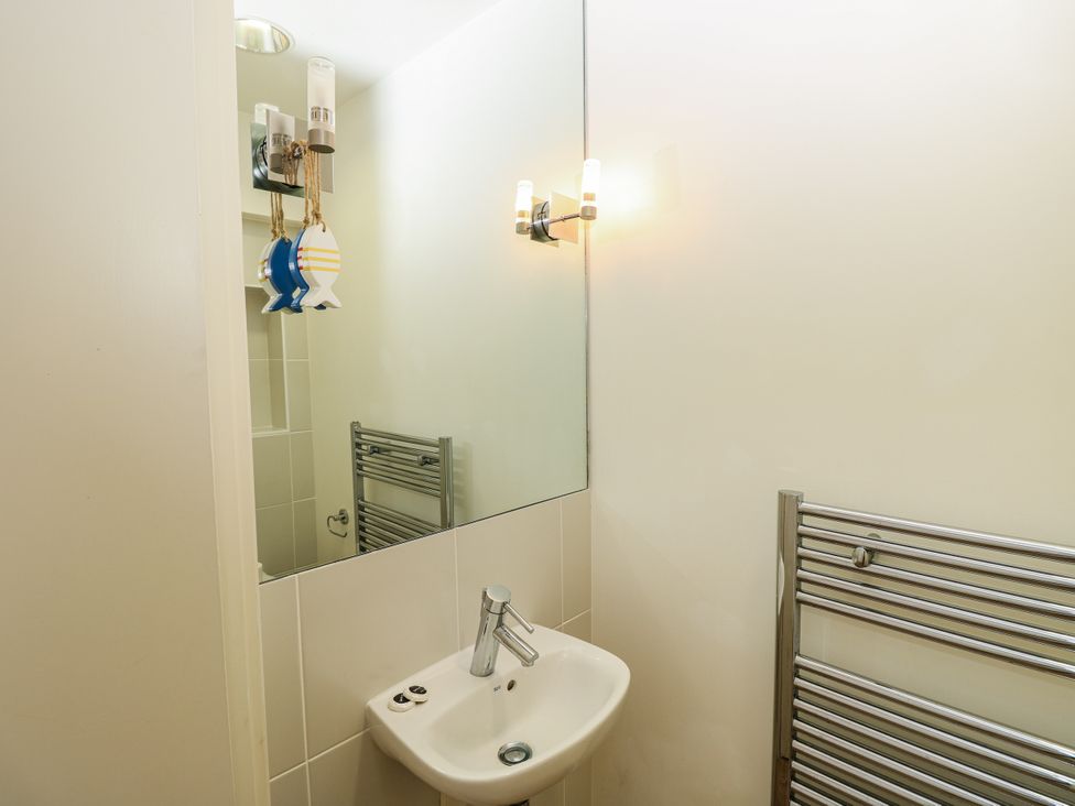 A bathroom with a sink and mirror at Vermont 4 in Yarmouth