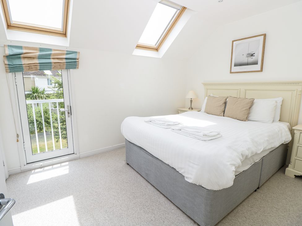 A bedroom with a bed and bedside table at Vermont 4 Yarmouth