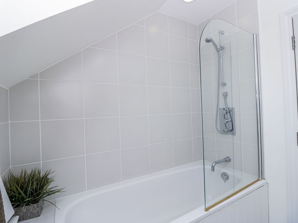 A bathroom with a bathtub and shower at Vermont 4 Yarmouth