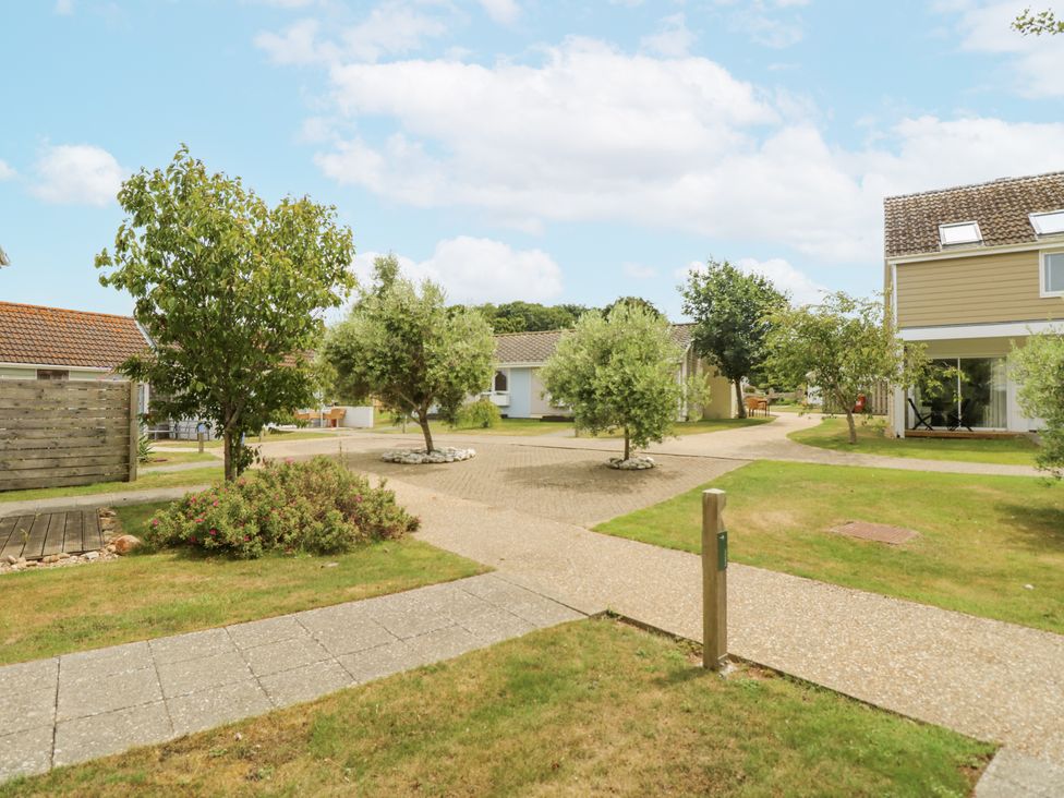 An outdoor area with trees and pathways at Vermont 4 in Yarmouth