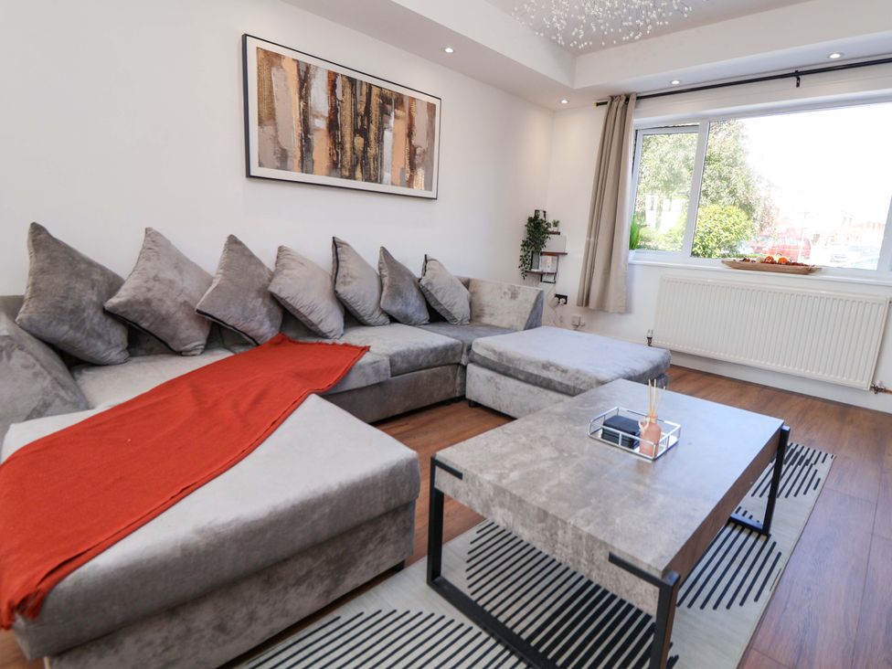 A living room with a sofa and coffee table at 11 Coniston Road in Chester