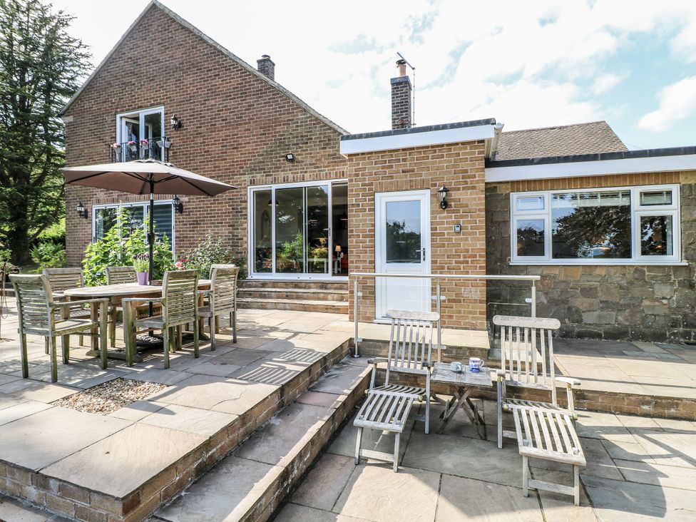 An outdoor area with a table and chairs at The View @ Orchard View in Hognaston